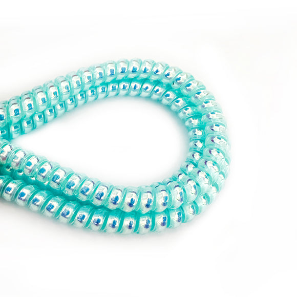 Pearlescent blue cable twist for cochlear implants and hearing aids