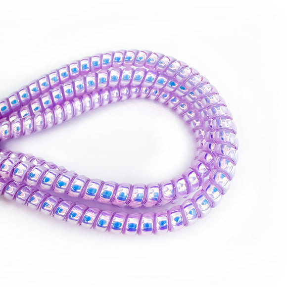 Pearlescent purple cable twist for cochlear implants and hearing aids