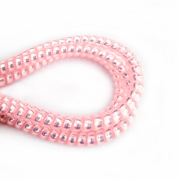 Pearlescent pink cable twist for cochlear implants and hearing aids
