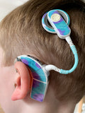 Tube twist for cochlear implants and hearing aids